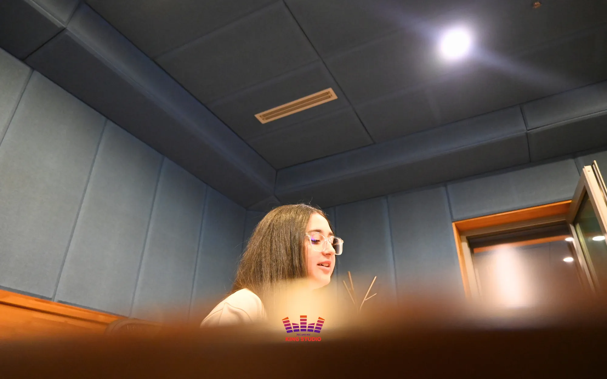 Assigning vocal parts and adjusting accompaniment key before recording — a must-know step in any Seoul Guide Travel Kpop session at KING STUDIO