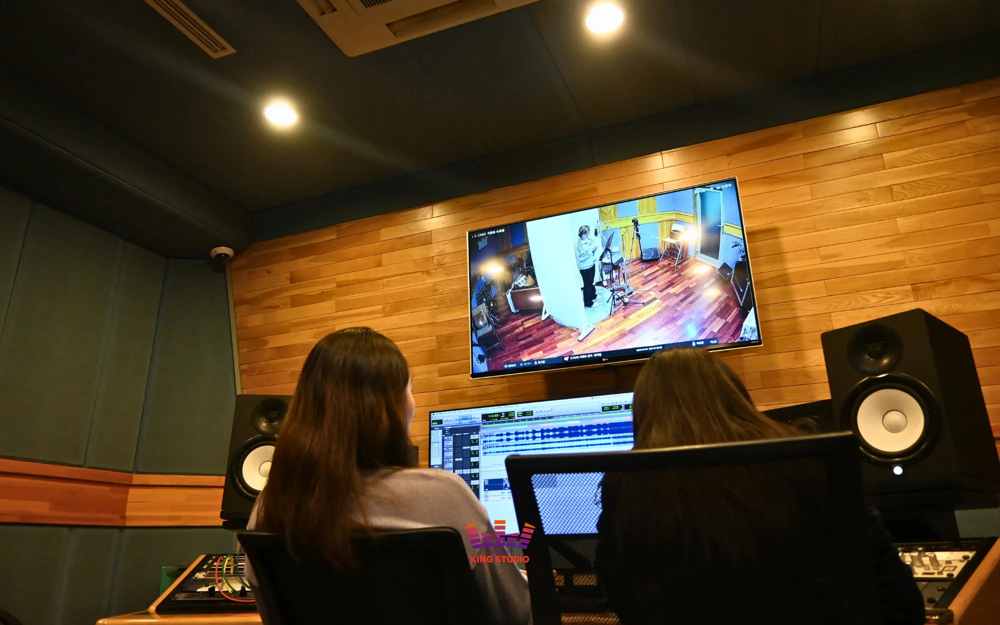 Guest recording inside the professional booth just like a real Kpop idol during a Korea Travel experience at KING STUDIO