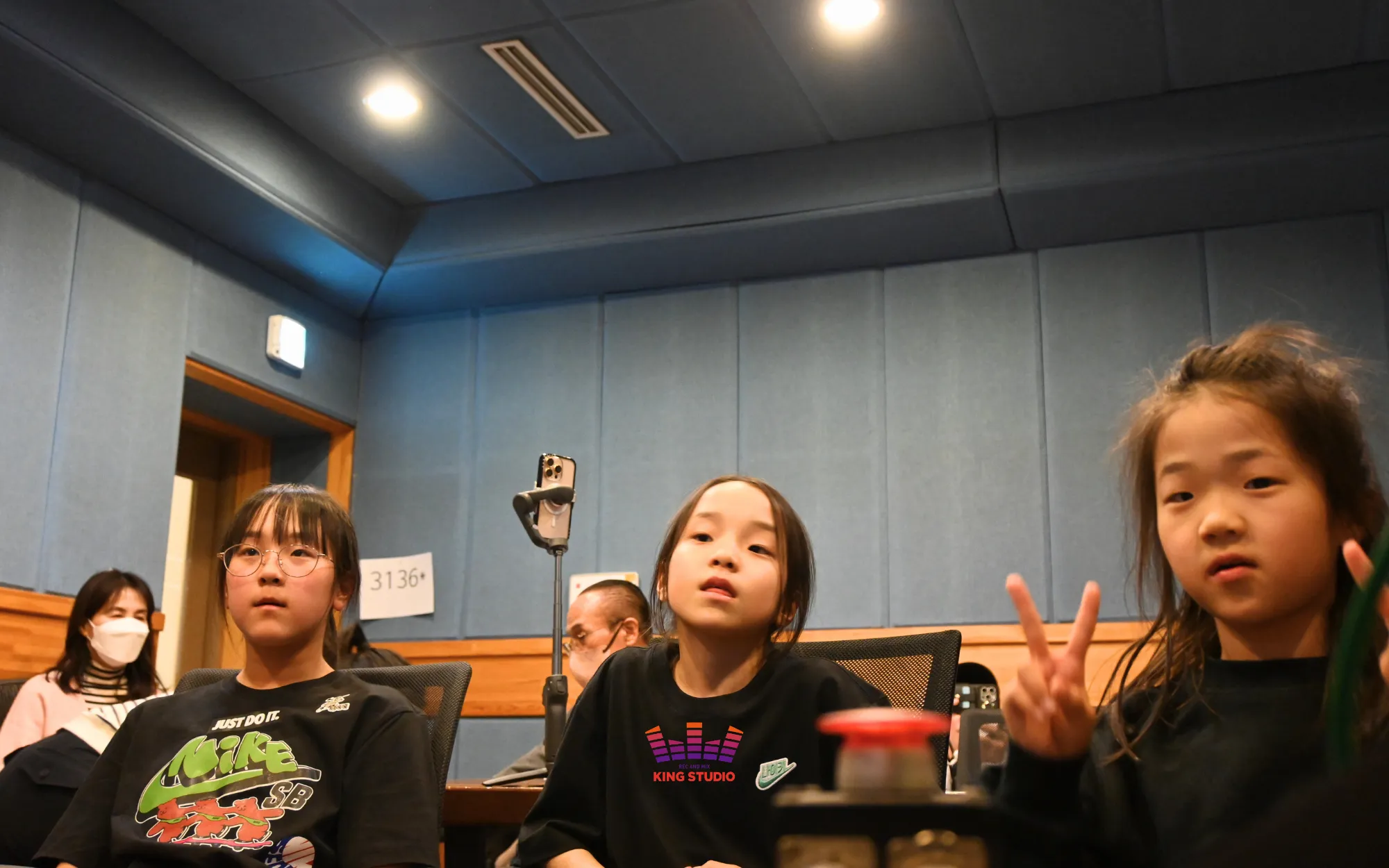 Sisters listening back to their mixed "STYLE" master in the control room