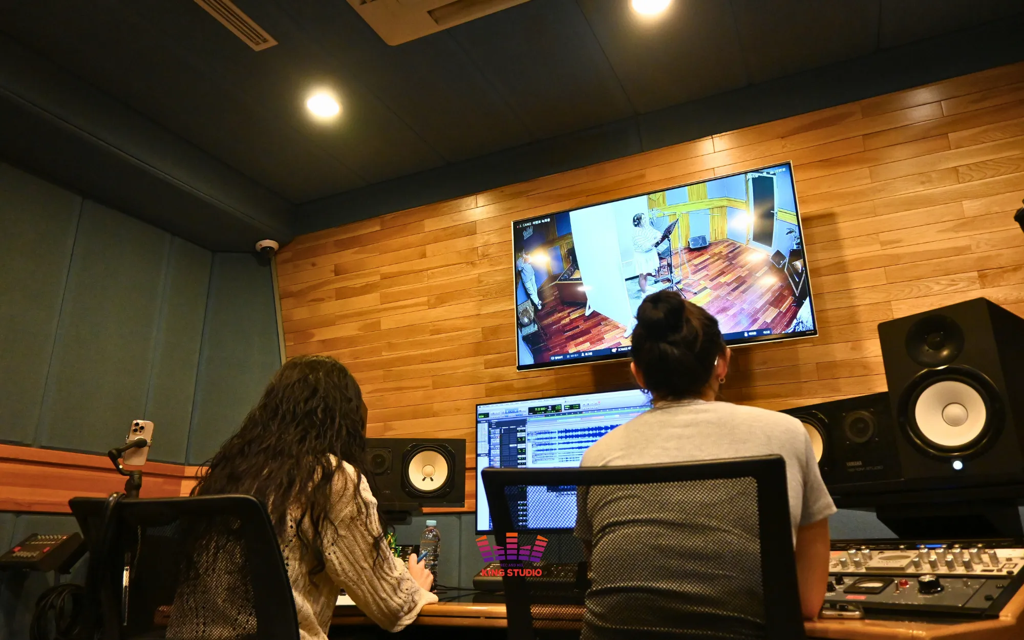 Kimberly listening back to her finished, monitored recording at KING STUDIO