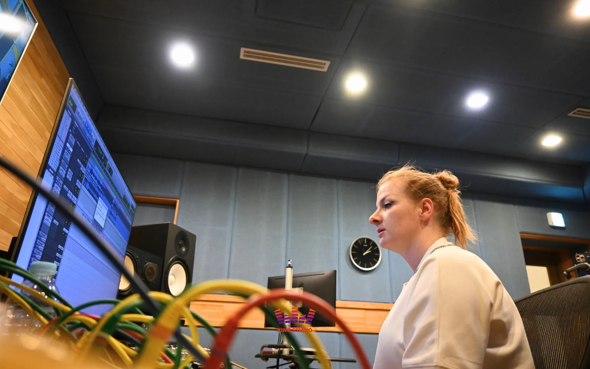 Listening back to the final monitored recording at the studio console