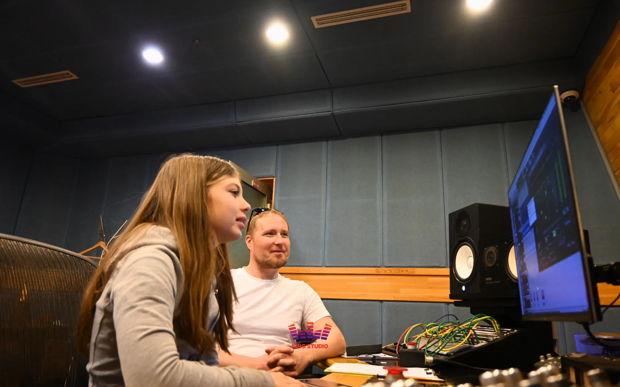 Alina listening back to her mixed and mastered take in the King Studio control room