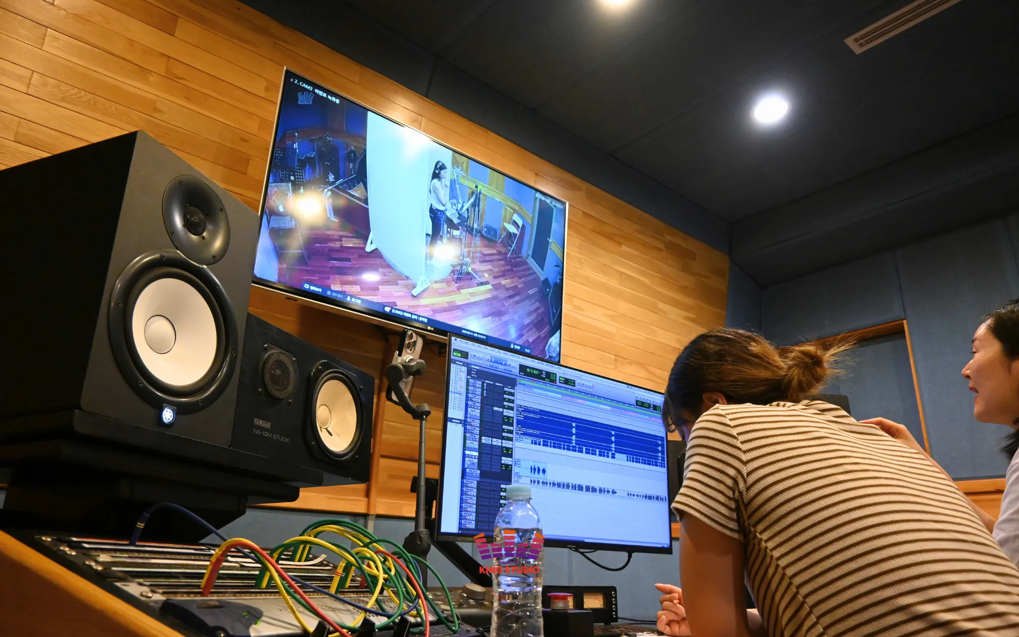 Vocal director giving breath and pitch direction in the booth — KING STUDIO Seoul