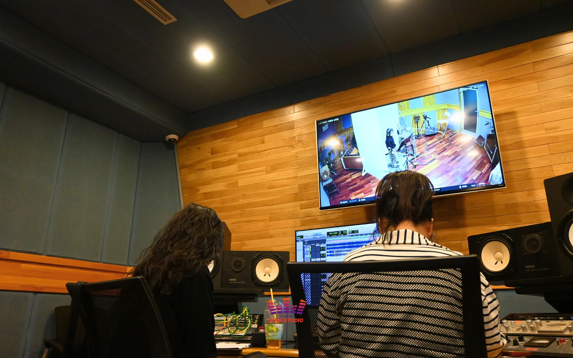 Vocal director Jiseon directing a take from the KING STUDIO control room