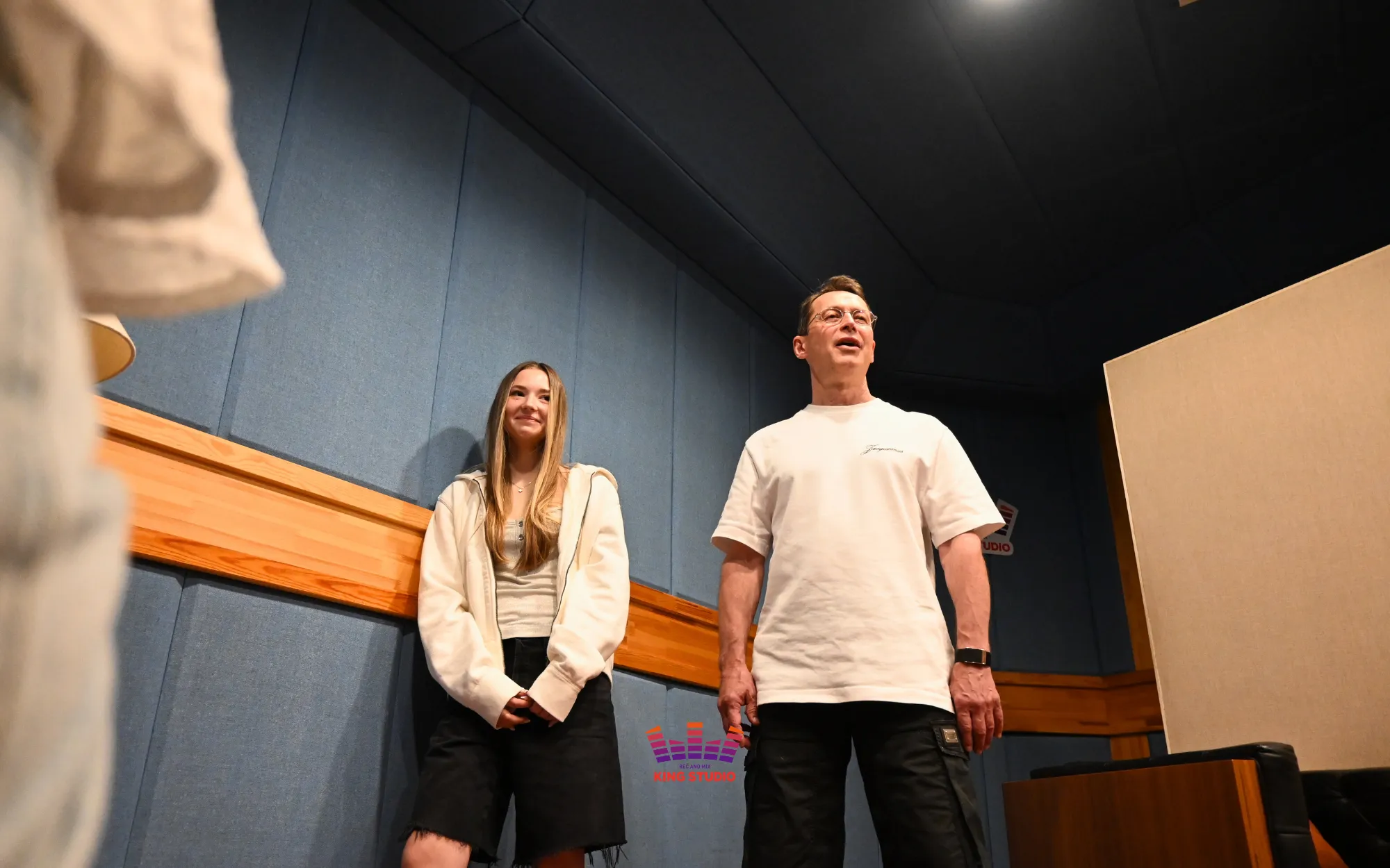 Vocal director Lusia leading a vocal training session with Kira