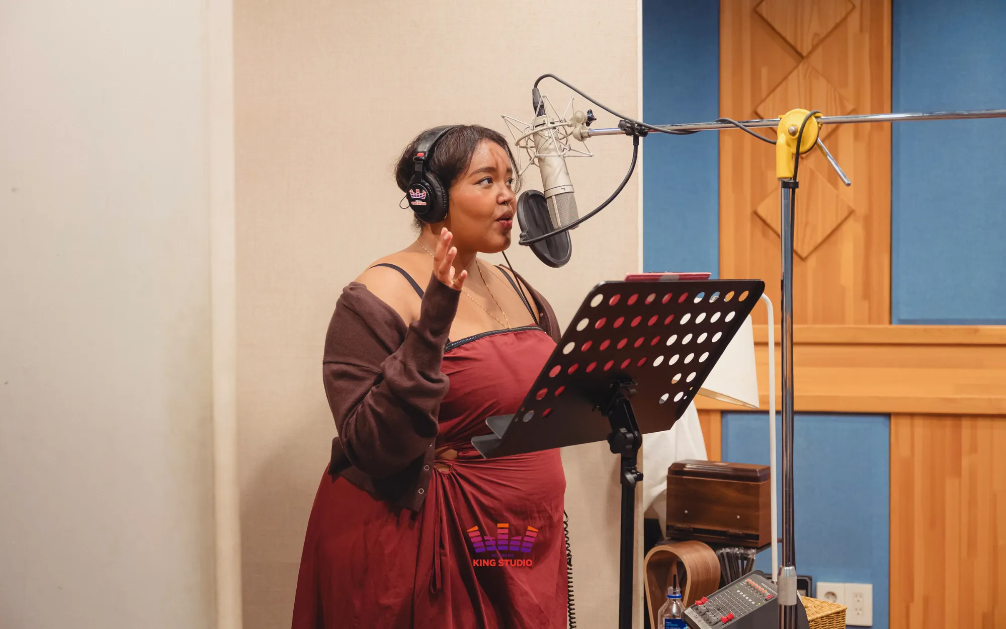 KING STUDIO vocal director playing back a visitor's take and giving a verbal assessment