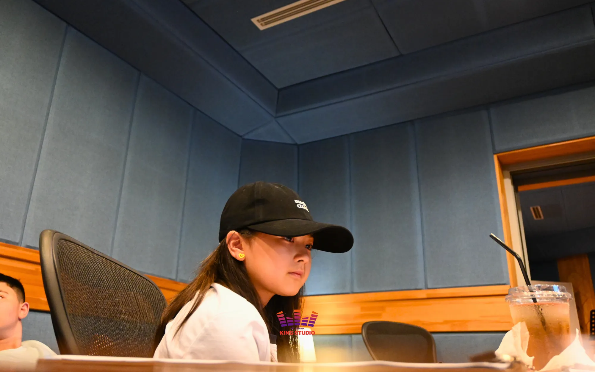 Vocal director running pitch and tempo training with Hayley